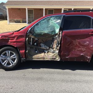 Red SUV crashed into, personal injury car accident.